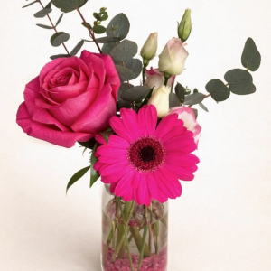 Milk bottle arrangement with Ecuadorian rose, Gerbera daisy, lisianthus and eucalyptus