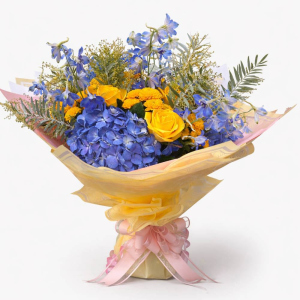 large posy with violet and yellow flowers tied in pink bow