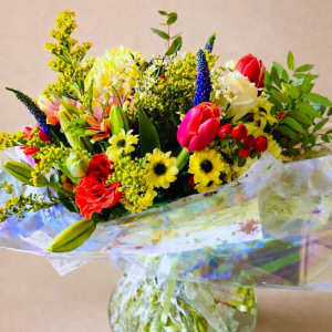 multicoloured flower arrangement in glass vase