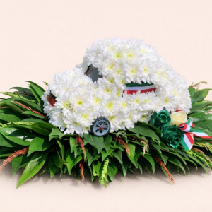 car of white flowers on green foliage