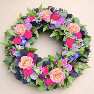 circular bouquet with red and yellow flowers