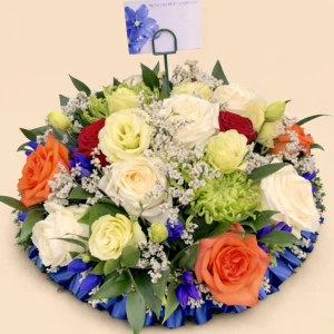 posy pad with orange, green, ivory, and red blue flowers