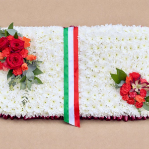book made with white flowers and red flowers in corners