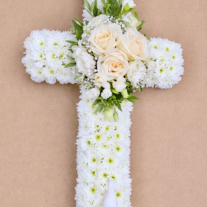 White cross with pink flowers in centre