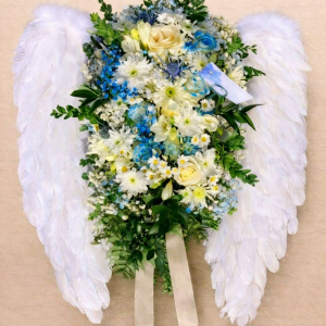 white wings with flower spray of yellow, blue and white