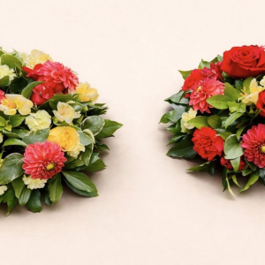 two bouquets with with red and yellow flowers