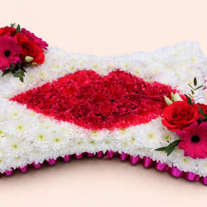 white flowers with red lips and two red sprays