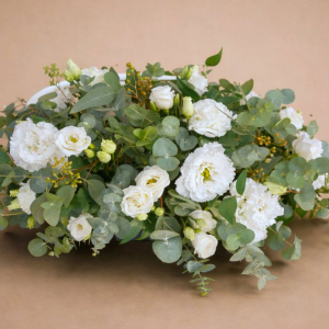 simple spray of white flowers on bed of green foliage