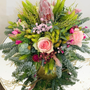 posy with multi-coloured flowers and green foliage